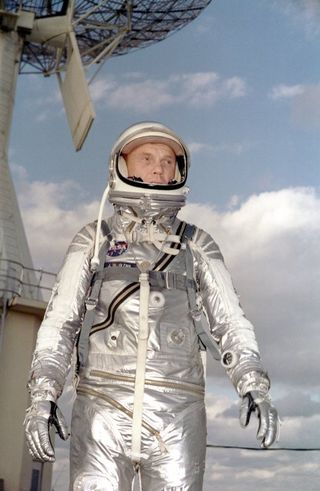 Astronaut John H. Glenn Jr. in his silver Mercury spacesuit during pre-flight training activities at Cape Canaveral. On February 20, 1962 Glenn lifted off into space aboard his Mercury Atlas (MA-6) rocket and became the first American to orbit the Earth. After orbiting the Earth 3 times, Friendship 7 landed in the Atlantic Ocean 4 hours, 55 minutes and 23 seconds later, just East of Grand Turk Island in the Bahamas. Glenn and his capsule were recovered by the Navy Destroyer Noa, 21 minutes after splashdown.