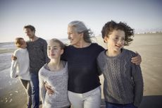 Widowed grandmother on the beach with her family.