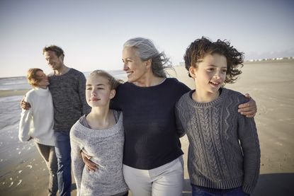 Widowed grandmother on the beach with her family.