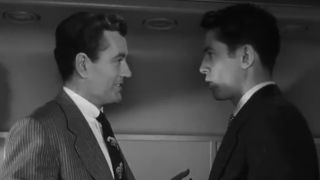 Farley Granger and Robert Walker discussing murder in Strangers on a Train