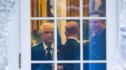 Peter Navarro, Stephen Miller and Elon Musk converse in the Oval Office