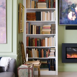 green living room with bookcase