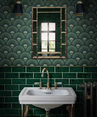 timeless interior design styles, green art deco style bathroom, green fan wallpaper, gold faucet, gold mirror, gold and black wall lights, green tiles