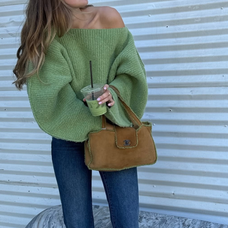 green sweater and jeans outfit