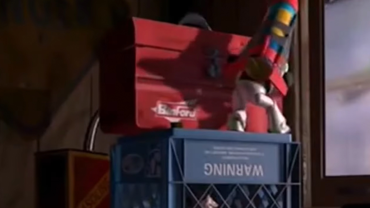 Buzz Lightyear trying to move a Binford Tool box in Toy Story