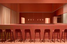 Bar with stools, all in red tones