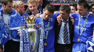 LONDON, UNITED KINGDOM: Chelsea players Petr Cech (L) John Terry (R) and Frank Lampard (C) look at the trophy with their Manager Jose Mourinho (2nd R) during the celebrations following the game against Charlton at Stamford Bridge in London 07 May 2005. Chelsea won the game 1-0 and were presented with the trophy and crowned Premiership champions. AFP PHOTO ADRIAN DENNIS No telcos, website uses subject to subscription of a license with FAPL on www.faplweb.com (Photo credit should read ADRIAN DENNIS/AFP via Getty Images)