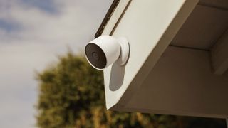 The Nest Cam mounted to the edge of a roof of a house