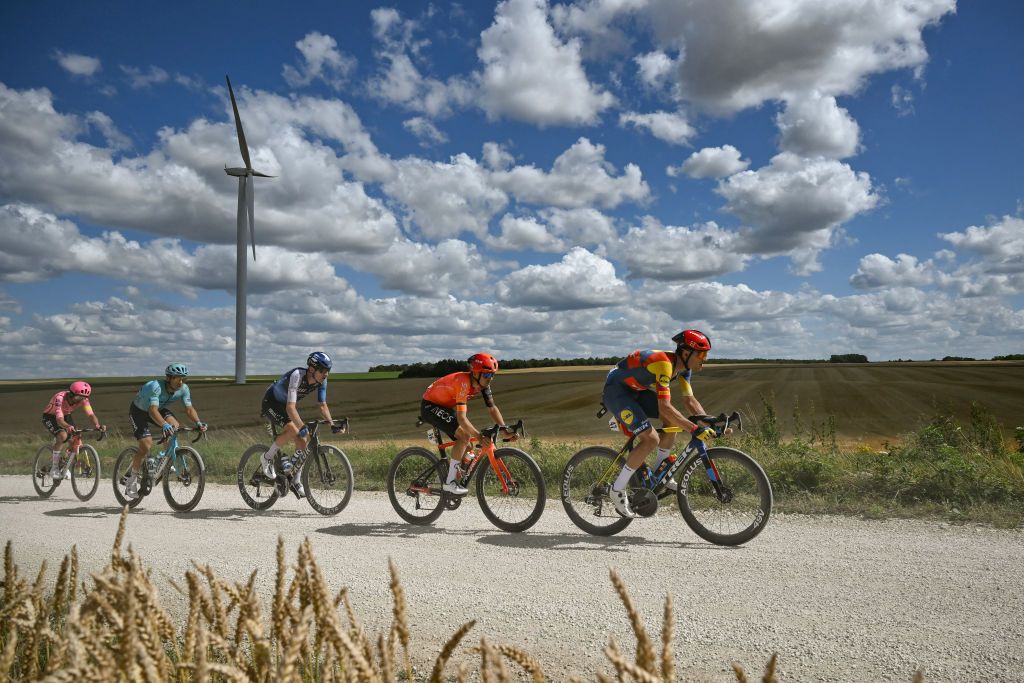 Lidl - Trek team's Belgian rider Jasper Stuyven (R) leads a breakaway over the Plateau de la Cote des Bar "Chemin Blanc" (white road) gravel sector during the 9th stage of the 111th edition of the Tour de France cycling race, 199km stage departing and finishing in Troyes, on July 7, 2024. (Photo by Marco BERTORELLO / AFP)