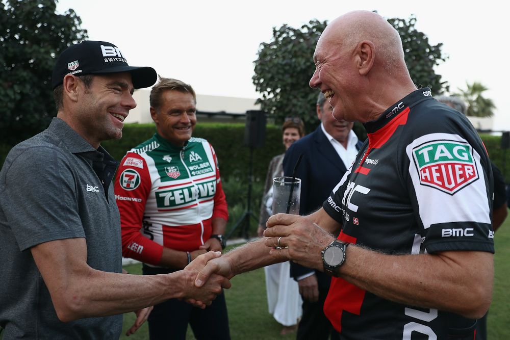 Tour de France winner Cadel Evans (l) shakes hands with Jean-Claude Biver, TAG Heuer CEO, prior to a press conference to announce Tag Heuer as a new sponsor of the BMC Cycling team