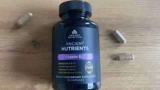 Ancient Nutrients B12 capsules and container on a table