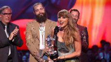 Taylor Swift holds award at MTV Video Music Awards