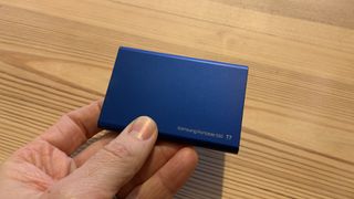 Samsung T7 SSD held in a hand