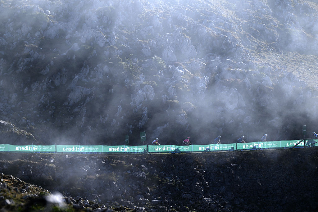 L&#039;ANGLIRU, SPAIN - SEPTEMBER 05: A general view of the peloton climbing the L&#039;Angliru while fans cheer during the La Vuelta - 80th Tour of Spain 2025, Stage 13 a 203.7km stage from Cabezon de la Sal to L&#039;Angliru 1556m / #UCIWT / on September 05, 2025 in L&#039;Angliru, Spain. (Photo by Dario Belingheri/Getty Images)