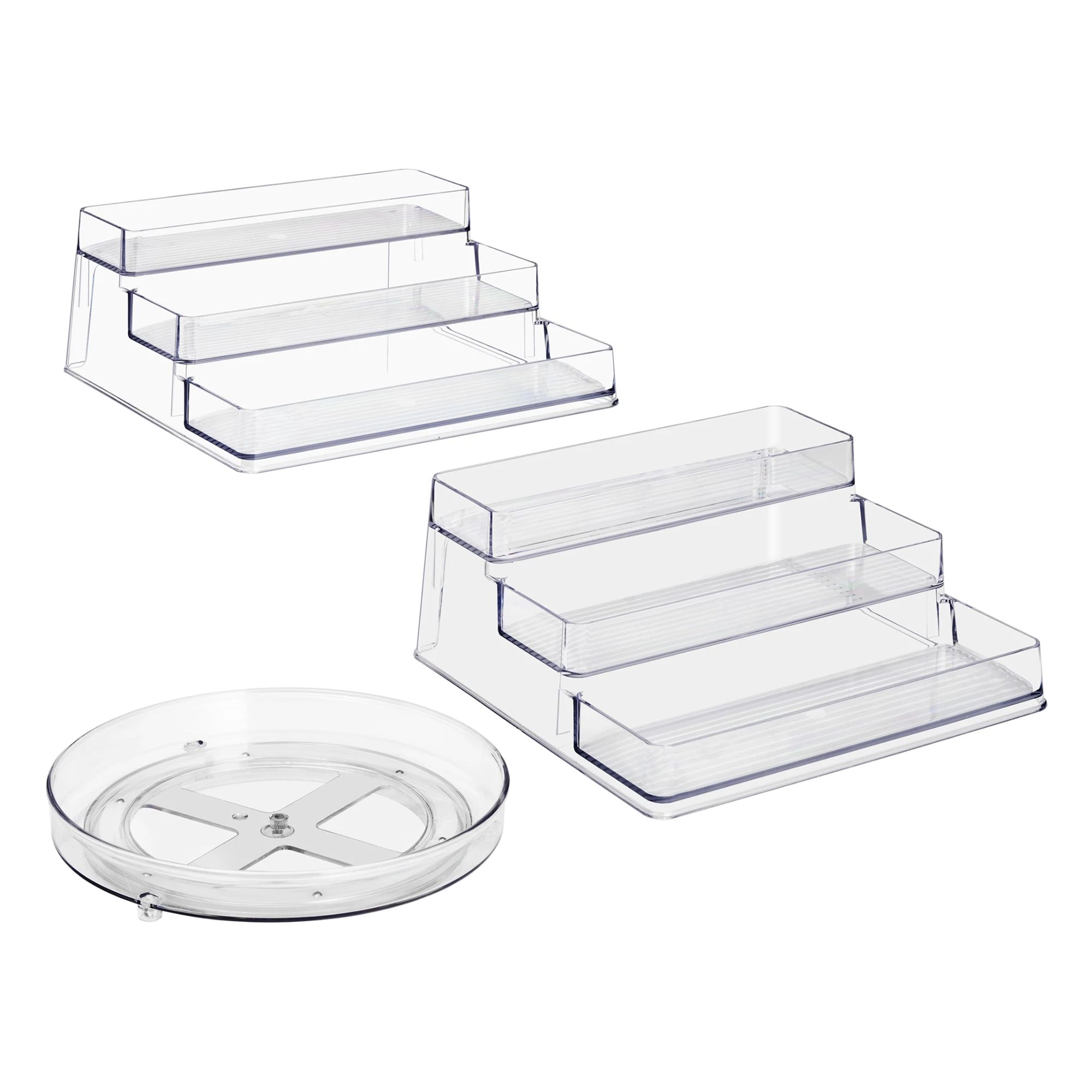 Two clear acrylic shelf risers, and a clear acrylic lazy susan