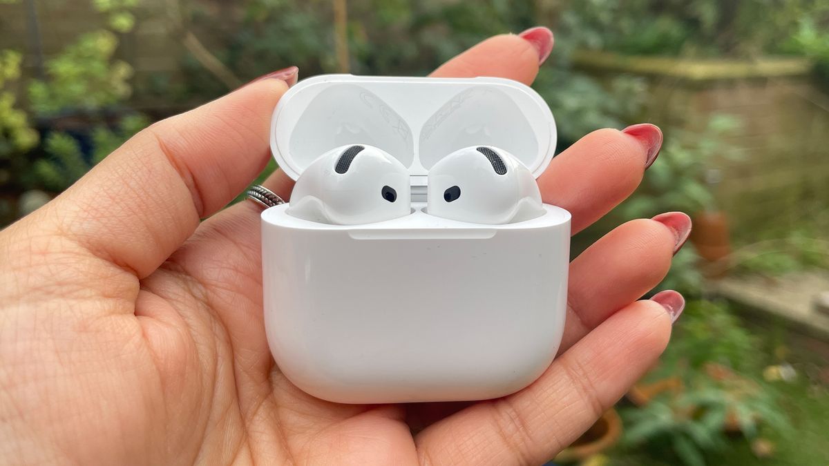 Apple AirPods 4 with ANC wireless earbuds held in hand