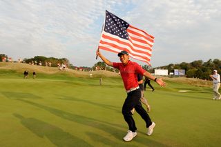 Anthony Kim holding a big USA flag at the 2008 Ryder Cup