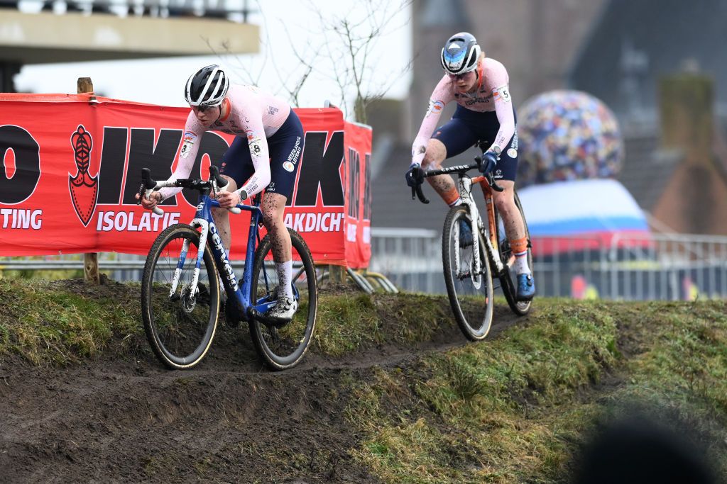HOOGERHEIDE NETHERLANDS FEBRUARY 04 LR Fem van Empel of The Netherlands and Puck Pieterse of The Netherlands compete during the 74th World Championships CycloCross 2023 Womens Elite CXWorldCup Hoogerheide2023 on February 04 2023 in Hoogerheide Netherlands Photo by David StockmanGetty Images