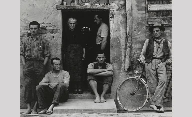A powerful tableau of an Italian widow and five of her eight sons.
