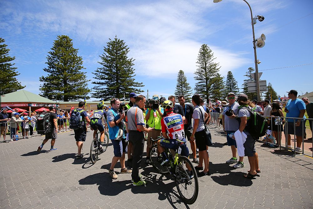 Media gather around stage 3 winner Caleb Ewan