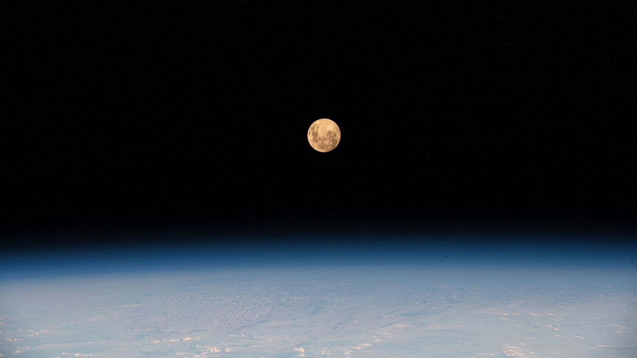 The Super Pink Moon of April 26, 2021 is seen from the International Space Station, as it was orbiting 267 miles (430 kilometers) above the southern Indian Ocean.
