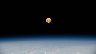 The Super Pink Moon of April 26, 2021 is seen from the International Space Station, as it was orbiting 267 miles (430 kilometers) above the southern Indian Ocean.