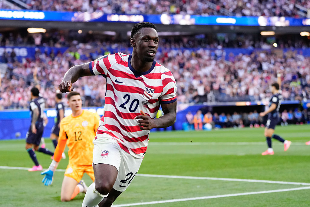 Folarin Balogun running in celebration after scoring for USA against Paraguay at the World Cup 2026.