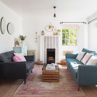 white painted living room with tiled fireplace and vintage furniture