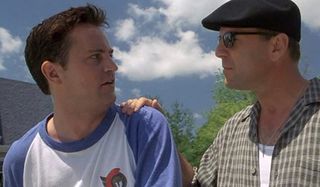 Bruce Willis puts his hand on Matthew Perry's fearful shoulder in The Whole Nine Yards.