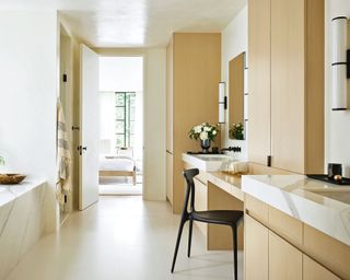 Dressing space with white oak cabinetry in 1920s San Francisco house