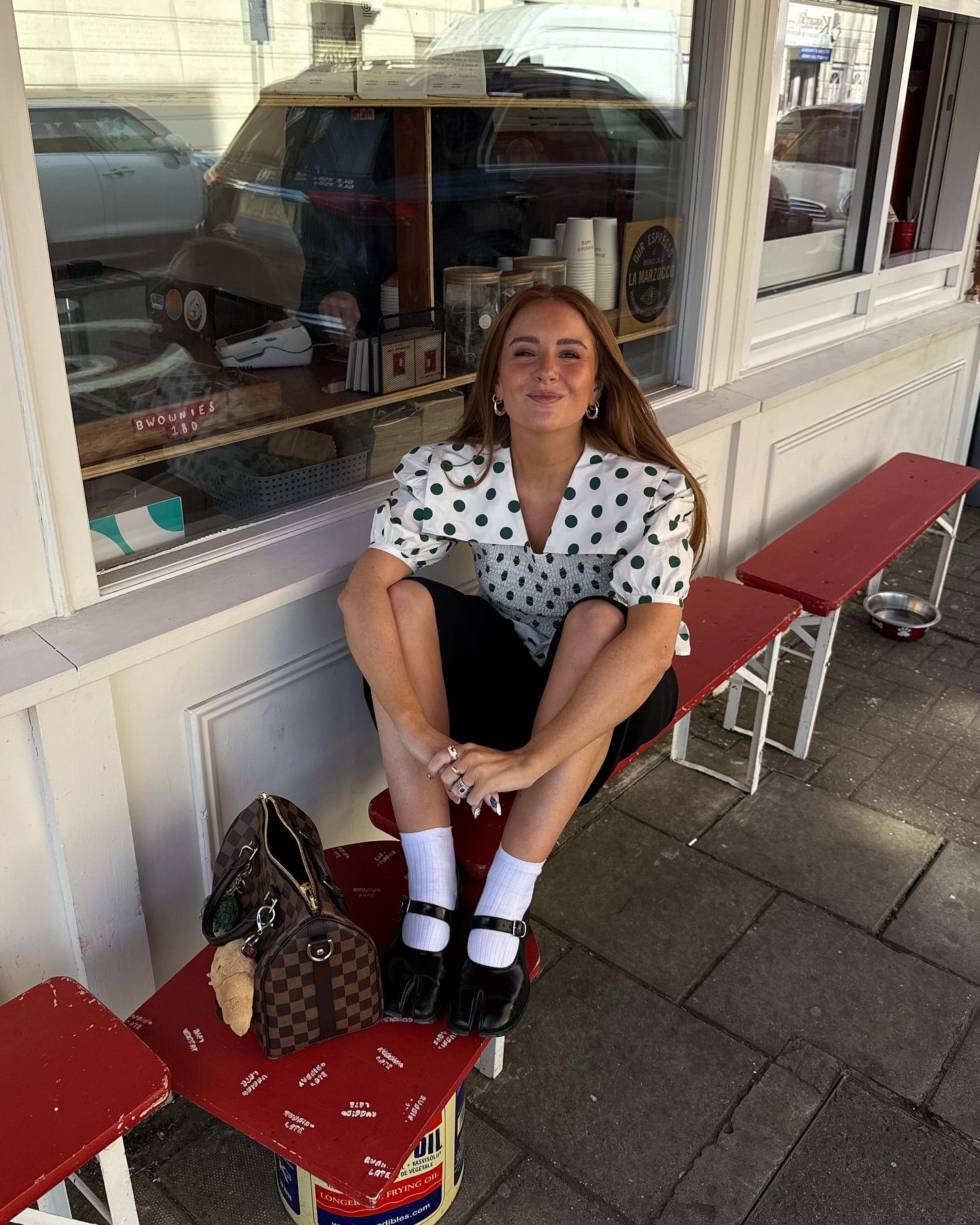 Influencer wears the Shrimps blouse.