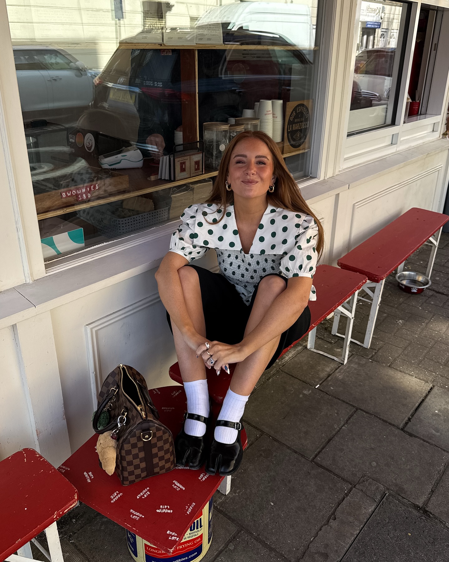Influencer wears the Shrimps blouse.