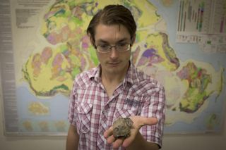 Julien Benoit holds the Euchambersia fossil that was discovered near Colesberg, in the Eastern Cape Province of South Africa, in 1966.