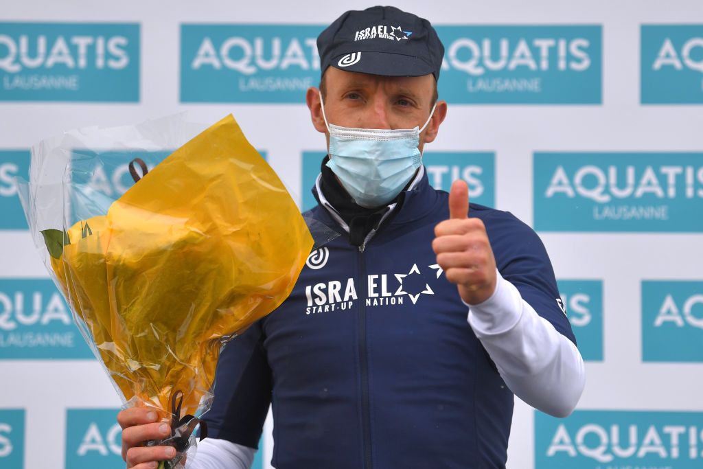 THYON 2000 LES COLLONS SWITZERLAND MAY 01 Michael Woods of Canada and Team Israel StartUp Nation celebrates at podium during the 74th Tour De Romandie 2021 Stage 4 a 1613km stage from Sion to Thyon 2000 Les Collons 2076m Mask Covid Safety Measures TDR2021 TDRnonstop UCIworldtour on May 01 2021 in Thyon 2000 Les Collons Switzerland Photo by Luc ClaessenGetty Images
