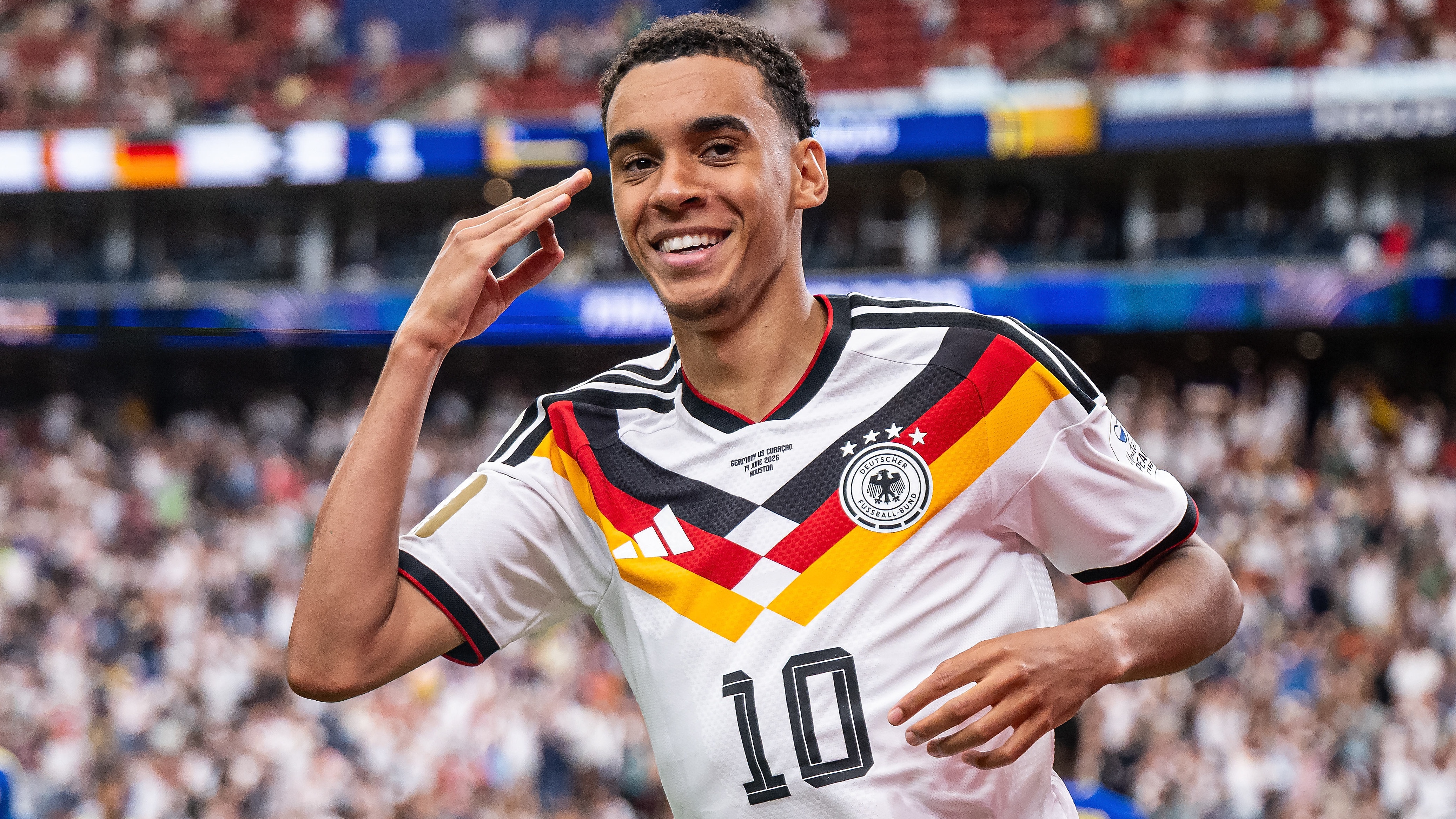 Jamal Musiala of Germany celebrates after scoring his team's fourth goal during the FIFA World Cup 2026 Group E match between Germany and Curacao at Houston Stadium.