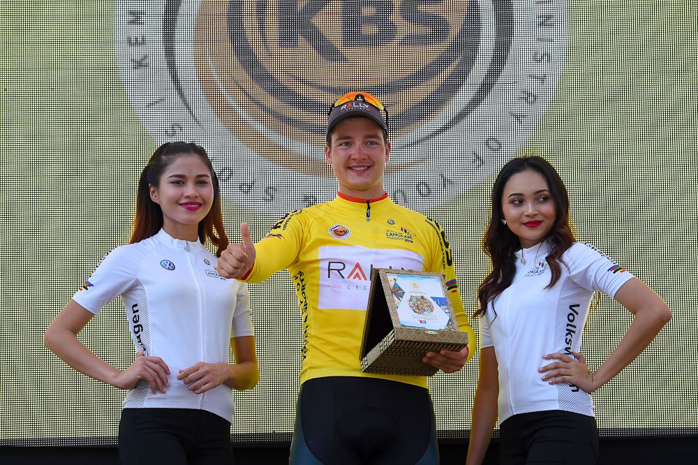Adam de Vos in yellow on the stage 3 podium at Tour de Langkawi