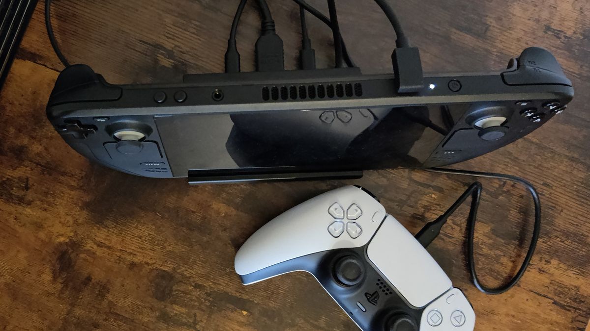 The Sabrent 6-Port Steam Deck dock top down with Steam Deck and PS5 controller plugged in..