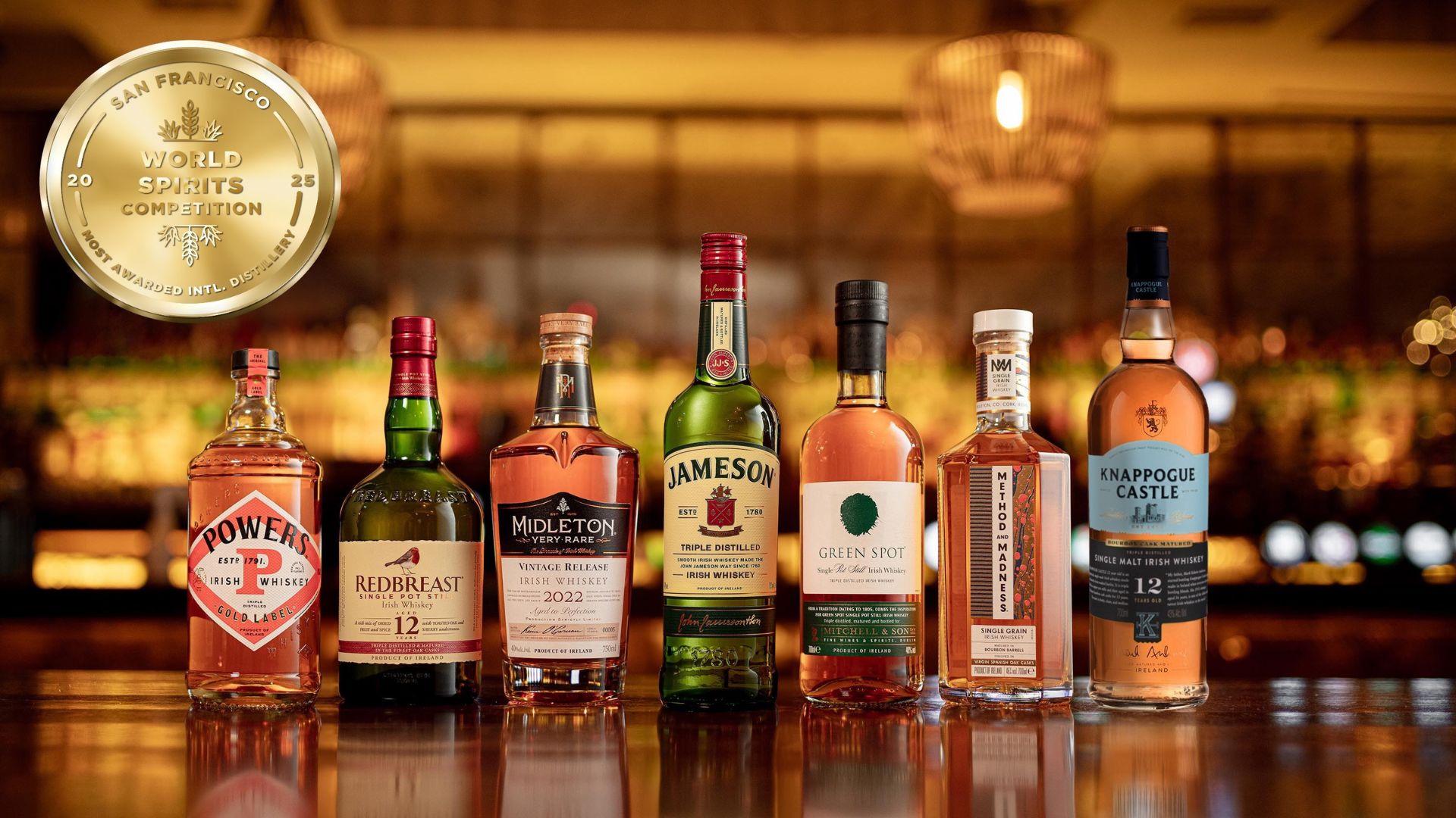 an image of Midleton's collection, from left to right, a bottle of Powers whiskey, Redbreast, Midleton Very Rare, Jameson, Green Spot, and Knappogue Castle