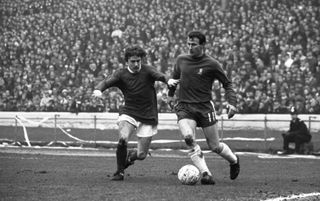 Chelsea's Peter Houseman is challenged by Manchester United's John Fitzpatrick in March 1969.