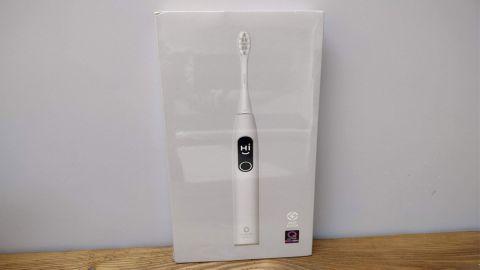 Image shows the Oclean X Pro Elite toothbrush in its packaging.