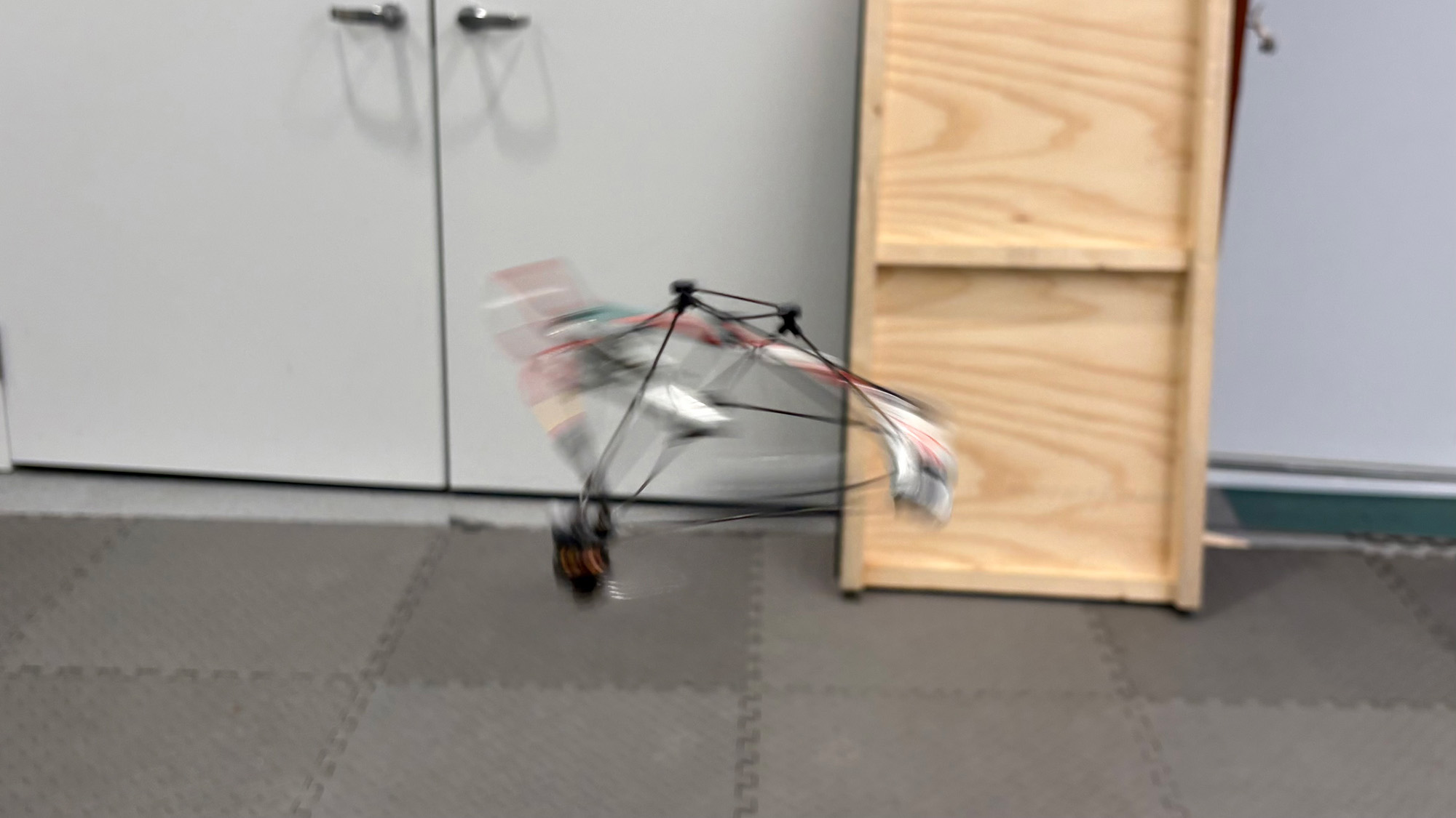 A drone spins in the middle of a large room