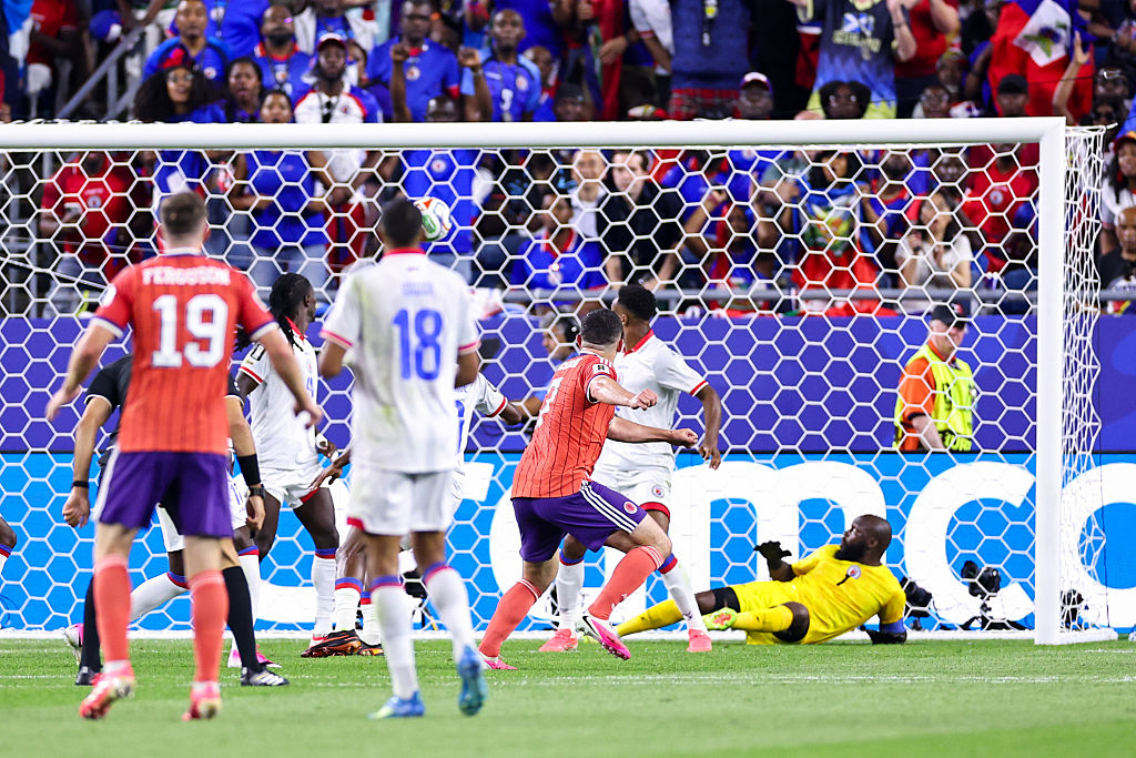 John McGinn's deflected strike ginds the net against Haiti