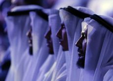 Men wearing traditional Emirati head coverings.