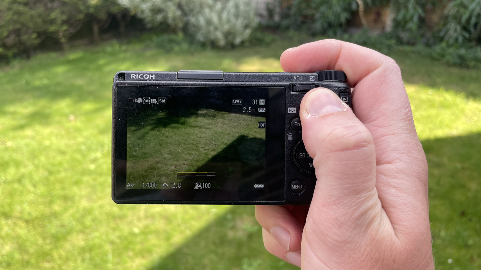 Ricoh GR IIIx HDF compact camera in hand