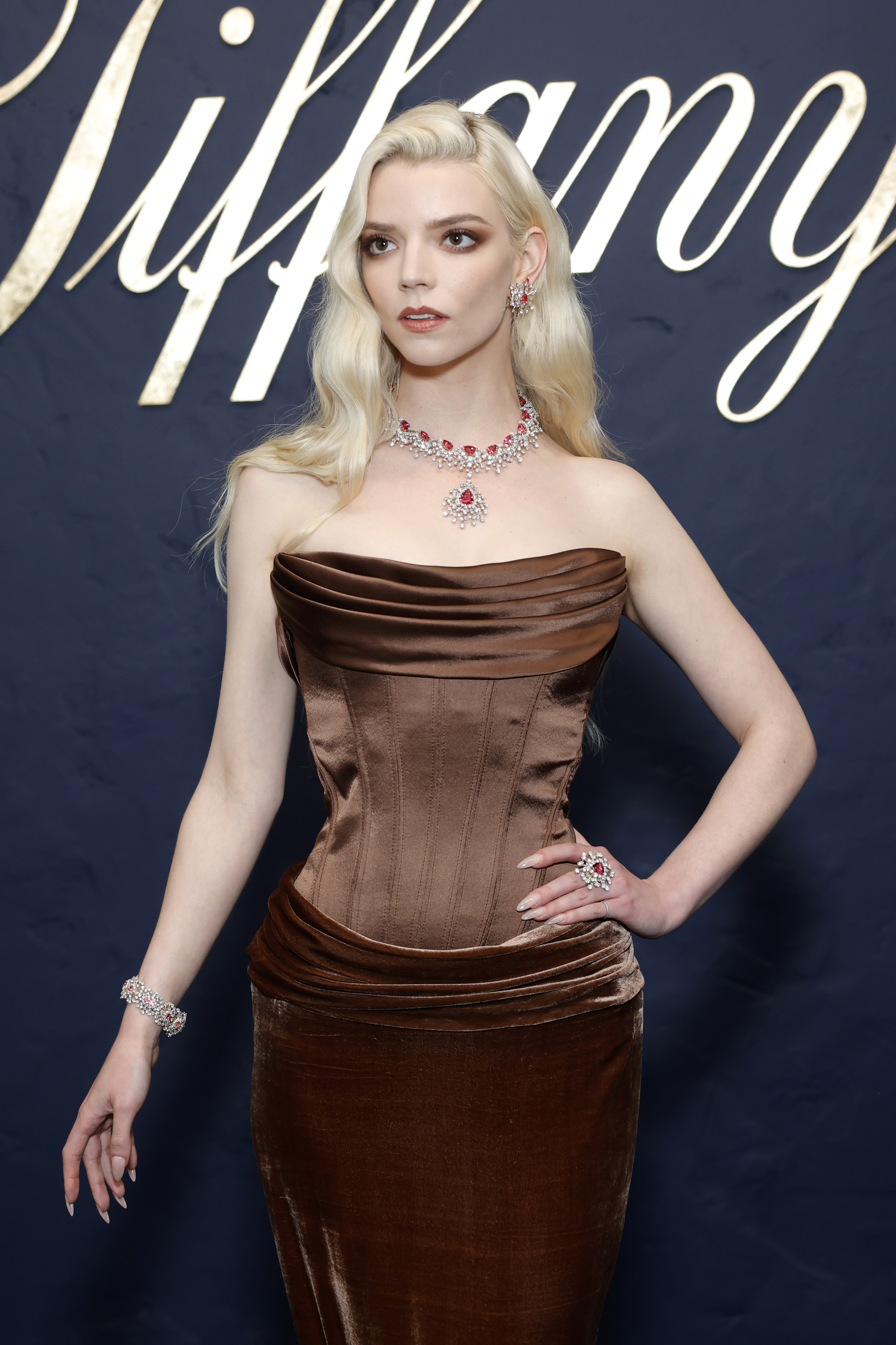 Anya Taylor Joy on a Tiffany step and repeat wearing a corset dress