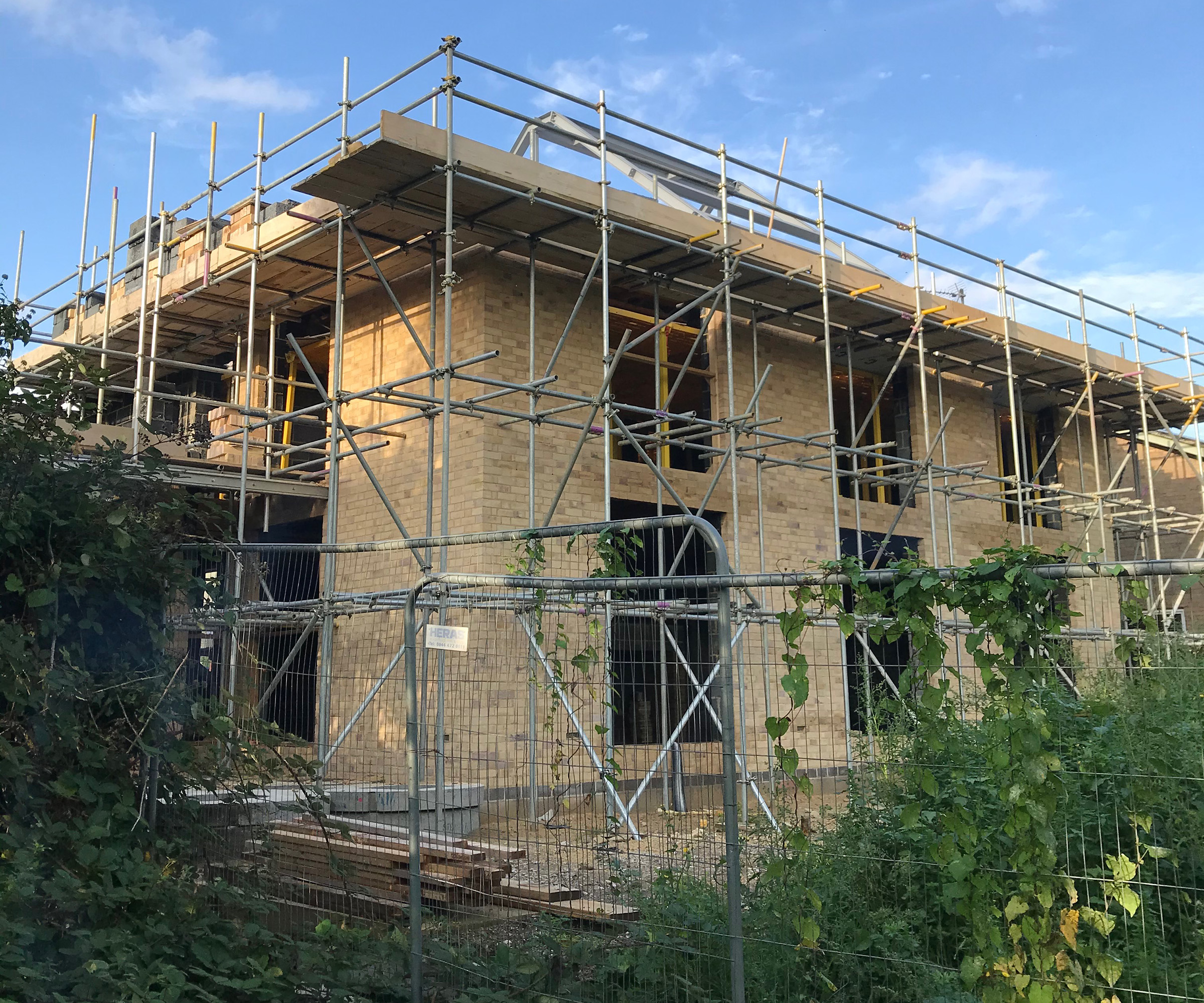A home being built and is under construction with scaffolding in place