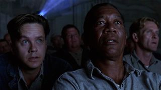 Tim Robbins and Morgan Freeman in a movie theatre. 