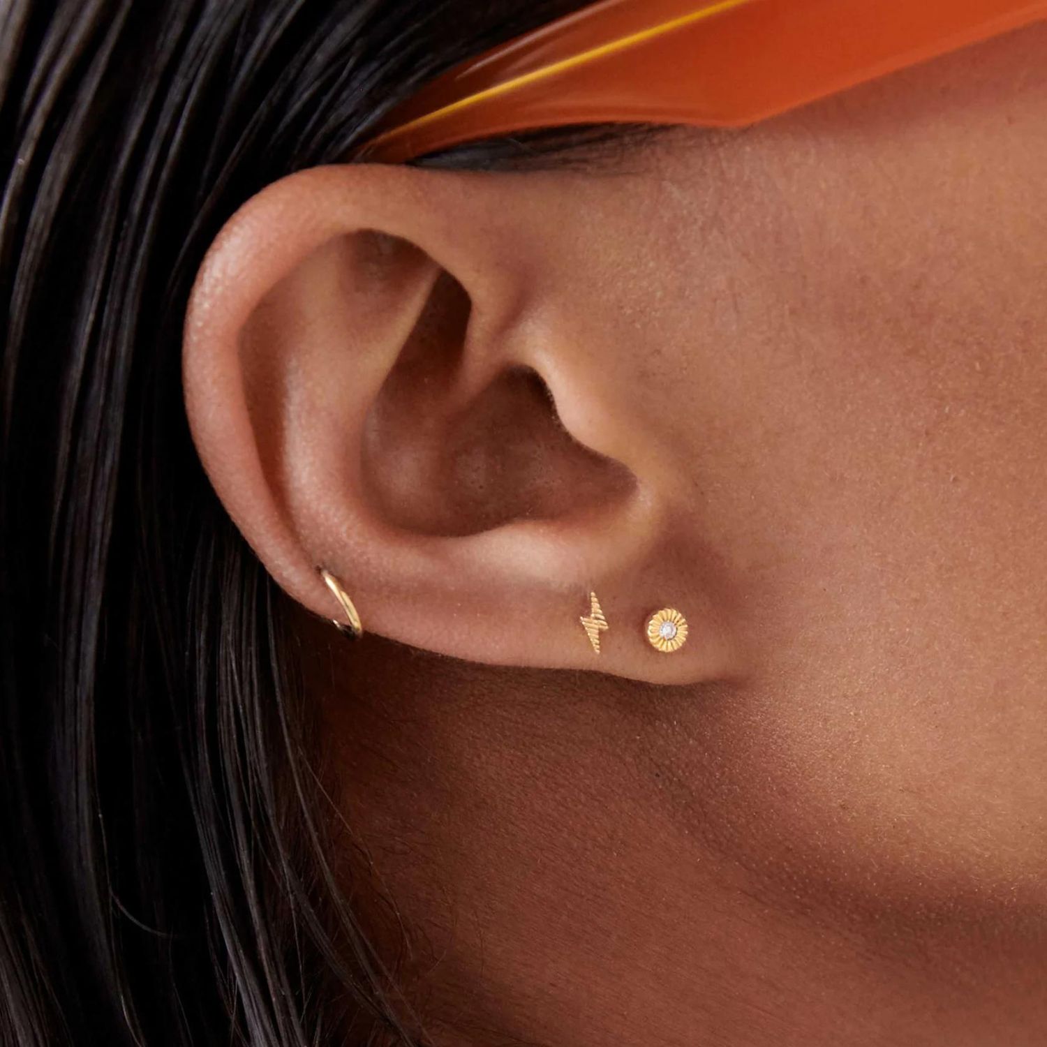 Flat back earrings are currently trending. Here’s why...