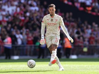 Ederson scores a penalty for Manchester City against Manchester United in a shootout in the Community Shield in August 2024.