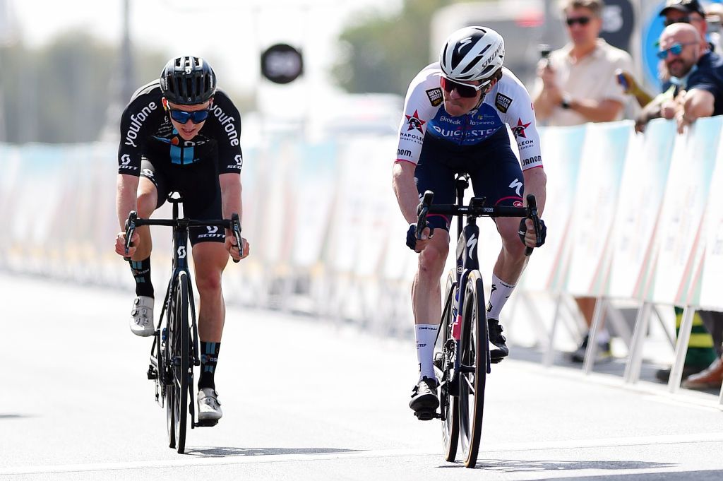 MUSCAT OMAN FEBRUARY 13 LR Kevin Vermaerke of United States and Team DSM and Mauro Schmid of Switzerland and Team QuickStep Alpha Vinyl react after cross the finishing line during the 11th Tour Of Oman 2022 Stage 4 a 1195km stage from Al Sifah to Mucat TourofOman on February 13 2022 in Muscat Oman Photo by Dario BelingheriGetty Images